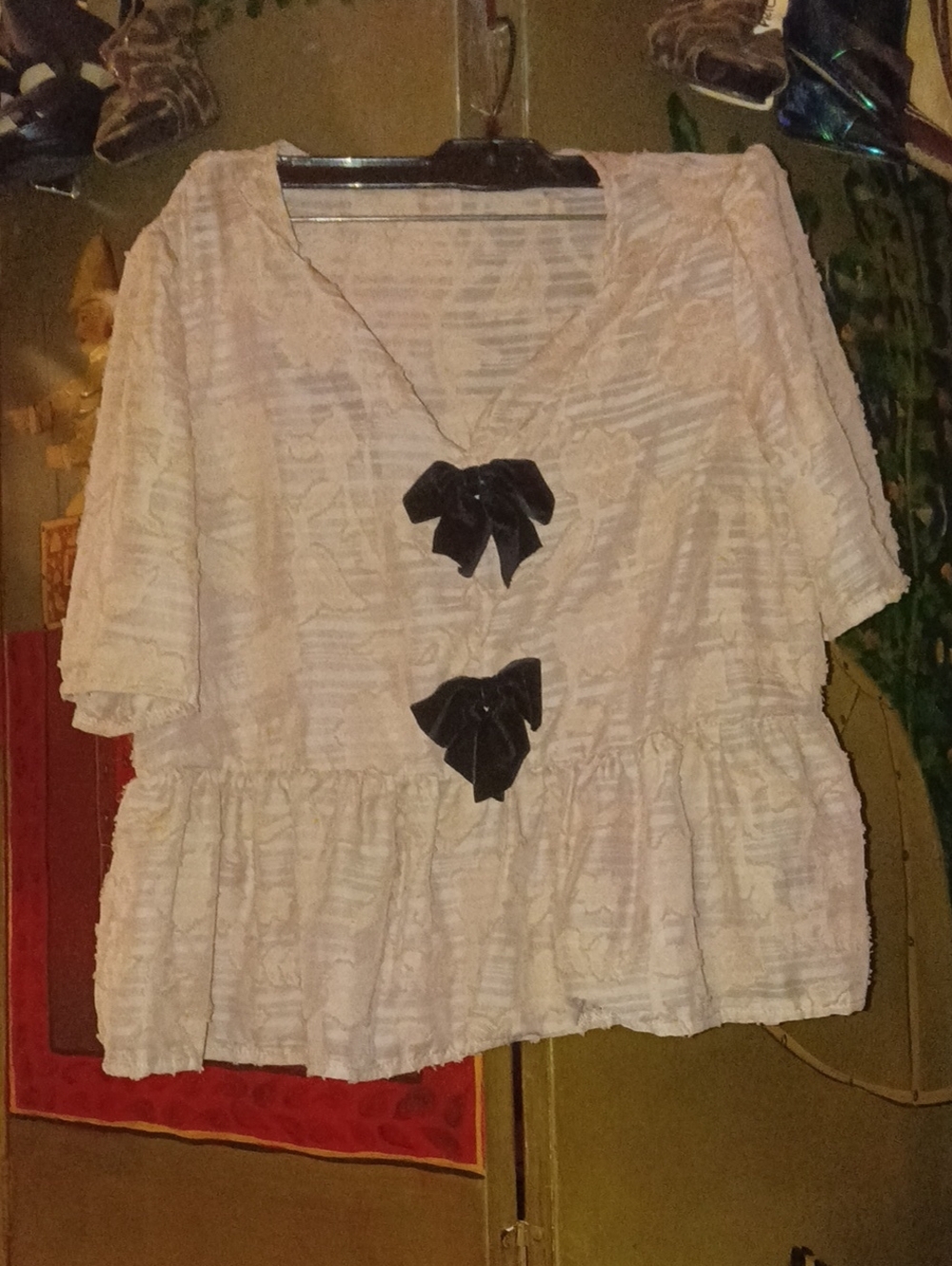 Light Cream Textured Peplum Top with Black Bow Accents